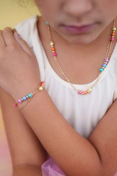 A unique pairing of dainty gold chains with pearly rainbow & metallic beads makes our Boutique Golden Rainbow bracelet as elegant as it is fun. Pair it with the Boutique Golden Rainbow necklace to complete the look, here! Card Packaging, Rainbow Necklace, Rainbow Bracelet, Easter Shopping, The Boutique, Jewelry Card, Look Here, Age 3, Arts And Crafts For Kids