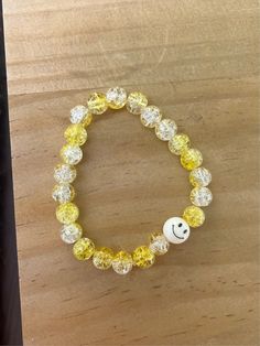 This is a larger sized bracelet, but can be made smaller for kids if needed. Glass beads are yellow and clear with a smiley bead included! Stretchy band. Yellow Adjustable Beaded Bracelets, Yellow Adjustable Beaded Bracelets Playful Style, Adjustable Yellow Playful Beaded Bracelets, Playful Adjustable Yellow Beaded Bracelets, Yellow Round Bead Bracelets For Everyday, Yellow Round Beads Bracelet For Everyday, Yellow Beaded Bracelets For Everyday, Yellow Beaded Bracelets With Round Beads For Everyday, Playful Yellow Beaded Bracelet For Friendship