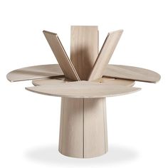 the circular table is made from wood and has four sections on each side, with one section