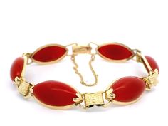 -Stone(s)- (6) Synthetic Coral - Marquise Cabochon - Bezel Set - Ox Blood red Color - 17.73 x 9.77mm (approx.) Material: 13k-14k Yellow Gold Weight: 16.64 Grams Length: Will comfortably fit 7" wrist (measured on wrist) Closure: Plush clasp w/ safety chain Width: 11.38mm (0.44") (approx.) Thickness: 5.10mm (approx. - rise off wrist) Condition: Shows some wear, original finish & patina preserved. Excellent overall condition. Stock Number: JO-16045099 Red Cabochon Jewelry For Formal Occasions, Oval Cabochon Bracelets For Formal Occasions, Red Polished Bracelets For Formal Occasions, Formal Oval Costume Jewelry Bracelets, Formal Oval Costume Jewelry Bracelet, Antique Red Bracelet For Formal Occasions, Formal Cabochon Bracelet Jewelry, Red Antique Bracelet For Formal Occasions, Vintage Red Gemstone Bracelets