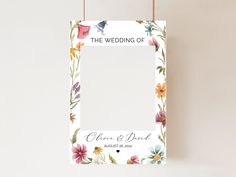 a wedding photo frame hanging on a wall