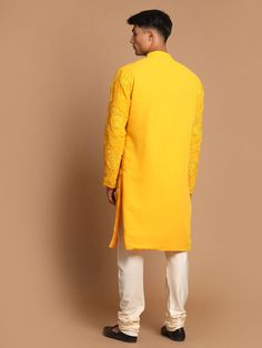 SHRESTHA BY VASTRAMAY Men's Yellow Embroidered Kurta Pyjama Set Look dapper in this ethnic set featuring a yellow kurta with intricate embroidery and a comfortable pyjama. Made with high-quality fabric, this set is perfect for festive occasions or a touch of tradition in your everyday wear. Key Features Embroidered kurta Comfortable pyjama Yellow color Specifications: Sleeve Length - Long Sleeves Top Shape Straight Top Hemline - Straight Top Length - Knee Length Neck Mandarin collar Top- Pattern Festive Cotton Bandhgala With Chikankari Embroidery, Bollywood Cotton Bandhgala With Floral Embroidery, Traditional Cotton Kurta With Naqshi, Traditional Cotton Bandhgala With Floral Embroidery, Cotton Bandhgala With Chikankari Embroidery For Navratri, Navratri Cotton Bandhgala, Festive Cotton Sherwani With Floral Embroidery, Festive Cotton Bandhgala With Naqshi Details, Festive Cotton Bandhgala With Naqshi