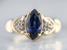 an oval shaped blue sapphire and diamond ring