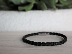 Handcrafted on Vancouver Island, this black leather bracelet is a versatile accessory. Wear this piece on its own, or with other bracelets or watches for a contemporary stacked look.  Featuring a stainless steel magnetic clasp, with an extra turn to lock, this bracelet is secure and durable. This excellent closure also makes it easy to take the bracelet on and off by yourself.  We have 4 different length options to ensure that you find the most perfect fit! To find your appropriate size, click t Modern Black Bracelet For Everyday Use, Black Bracelets With Strap For Everyday Use, Black Jewelry Bracelet Strap For Everyday Use, Black Bracelet For Everyday Use, Modern Black Bracelet For Everyday, Adjustable Black Bracelets For Everyday, Everyday Black Jewelry With Leather Strap, Leather Bracelet With Black Band For Everyday, Modern Black Bracelet