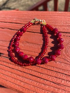 This elegant bracelet is made with red faceted beads and red glass beads on flexible beading wire with a gold toggle clasp. It measures approximately 8 inches long. This bracelet was made and designed by myself, and there are several more in my shop! I can take custom requests, sizing, colors, etc. Feel free to send a message with any questions or requests! <3 Red Crystal Bracelet With Spacer Beads, Red Czech Glass Bracelets With Colorful Beads, Red Beaded Bracelets With Spacer Beads For Party, Red Faceted Beaded Bracelets For Gifts, Adjustable Red Czech Glass Bracelets, Red Czech Glass Beaded Bracelets With Colorful Beads, Adjustable Red Czech Glass Bracelet, Red Faceted Round Bead Bracelets, Handmade Red Czech Glass Beaded Bracelets