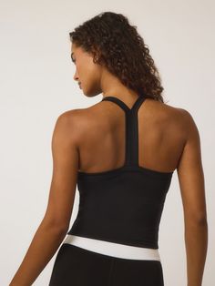 The Luna Racer Back Tank blends a sleek design with plenty of stretch and support. Its racerback design ensures freedom of movement while maintaining a flattering silhouette. Versatile and comfortable, this essential delivers both functionality and a modern spirit. 42% Recycled Polyester | 42% Polyester | 16% Elastane Compressive Racerback Tank Top For Sportswear, Functional Racerback Tank Top With 4-way Stretch, Compressive Breathable Racerback Tank Top, Sweat-resistant Racerback Tank Top For Running, Gym Tank Top With Medium Bust Support, Racerback, Freedom Of Movement, Racer Back, Sleek Design, Sleek