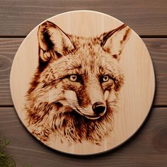 a wooden plaque with a drawing of a fox on it