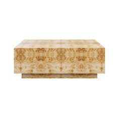 a large wooden box sitting on top of a white surface with an intricate design in the middle