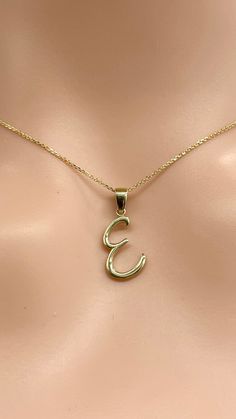 Wear one at a time or combined with your initials, your crush's, your pet's and while we're at it, your best friend's too. Showcase your favorites in gold layers. Made in Montréal Canada 🇨🇦. Details: Letter: E Gold: 10K Solid Gold Size: 15mm approximately  Weight: 0.7g approximately  Chain: 0.85mm Diamond Cut Cable Chain Length: 16-24 inches  Condition: New and Inspected for Quality Assurance  Please understand that the photos are ENLARGED to show detail for your benefit- please use the measur E Jewelry, All Letters, Letter Jewelry, Letter Pendant Necklace, Letter E, Women Christmas, Letter Pendants, Your Crush, Script Font