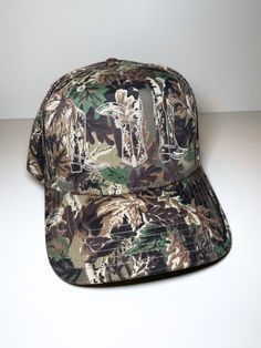 Embroidered camo canvas trucker hat in cream One size fits most - adjustable velcro closure Casual Camouflage 5-panel Baseball Cap, Military Style Adjustable Snapback Trucker Hat, Outdoor Camouflage Snapback Baseball Cap, Curved Bill Camouflage Hats For Streetwear, Military Style Adjustable 5-panel Trucker Hat, Adjustable Military Style 5-panel Trucker Hat, Adjustable Camouflage Baseball Cap With Curved Brim, Camouflage Baseball Cap One Size, Camouflage Trucker Hat With Curved Bill