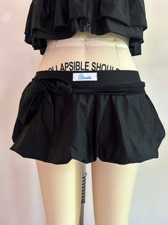 black jersey mesh fabric. model is seen wearing a size small. has shorts lining, and comes with a detachable belt. sizes S-XXL available. Quantities are ready to ship <3 material is 95% cotton, 5% spandex Black Skirt With Built-in Shorts For Beach, Black Mini Swim Skirt With Built-in Shorts, Chic Black Mesh Skirt, Fitted Mini Length Belted Shorts, Black Skort With Built-in Shorts, Fitted Belted Mini Length Shorts, Fitted Belted Mini Shorts, Belted Fitted Mini Shorts, Black Mesh Fitted Mini Skirt