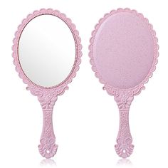 two pink mirrors sitting next to each other