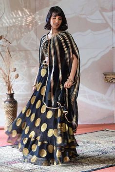 Black lehenga with circular geometric motifs. Paired with a geometric pattern cutdana embroidered blouse and cape with a fringe border and tie-up. - Aza Fashions Lehenga Banarasi, Cape Lehenga, Kurta Lehenga, Lehenga Pattern, Black Lehenga, Black Cape, Lehenga Skirt, Luxury Sale, Geometric Motifs