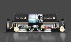 the exterior of a petrofac store with its lights on and water drops coming out