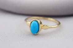 14k Solid Gold Turquoise Stone Ring - Blue Stone Gold Ring - Turquoise Stone Ring - Fine Jewellery -Birthday Gift - Gold Minimalist Ring This solid gold dainty ring is made entirely from 14k solid gold. * Jewelry is packaged and shipped in a delicate jewelry gift box. * If you are purchasing it as a gift, please feel free to add a personal note. Anniversary, Gift For Wife, Christmas Gift Gold Kt: 14K solid gold * Available Gold Color:  * Guaranteed Authentic 14k Gold, Not Plated Or Filled * Stam Blue Oval Dainty Birthstone Ring, Stone Gold Ring, Gold Dainty Ring, Gold Minimalist Ring, Turquoise Stone Ring, Ring Blue Stone, Must Have Jewelry, Wife Christmas, Ring Turquoise