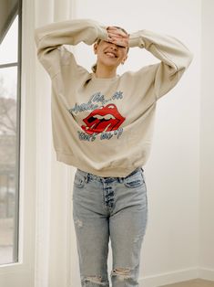 Our 50/50 Preshrunk Cotton/Polyester thrifted sweatshirts are meaningfully distressed and officially licensed. Each piece is one of a kind, and colors/distressing may vary from shirt to shirt.Pairs well with vintage denim and your favorite kicks.The details:- 50/50 Preshrunk Cotton/Poly Blend- Unisex Fit - Officially Licensed- Meaningfully Distressed, each piece unique- Colors + Distressing may vary - Model is 5'10" wearing a size X-Large Distressed Oversized Crew Neck Sweatshirt, Oversized Distressed Crew Neck Sweatshirt, Distressed Crew Neck Winter Top, Distressed Crew Neck Tops For Winter, Winter Crew Neck Distressed Tops, French Terry Crew Top With Graphic Print, Graphic Print French Terry Crew Top, Graphic Print Crew Top In French Terry, Graphic Print Crew Neck Top In French Terry