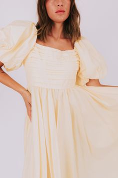 Have a slice of sweet style with our Lemon Meringue Dress! This dress will make you feel like a summer treat with its puffy sleeves, pleated bust, and square neckline. Perfect for sunny days and fun nights! Details Puffy sleeves Pleated bust Square neckline Lined to the knee Sizing Approximate measurements: SIZE LENGTH BUST Small 46" 36" Medium 47" 38" Large 50" 40" Fabric has no stretchModel is 5’8 wearing small Material Self 100% CottonLining 100% PolyesterHand wash coldHang to dry Square Neck Mini Dress With Gathered Sleeves For Brunch, Square Neck Mini Dress For Brunch, Square Neck Midi Dress For Day Out, Summer Flowy Puff Sleeve Dress With Gathered Neckline, Square Neck Ruched Puff Sleeve Dress For Brunch, Summer Mini Dress With Gathered Sleeves And Straight Neckline, Billowy Ruched Mini Length Puff Sleeve Dress, Billowy Ruched Puff Sleeve Mini Dress, Summer Square Neck Pleated Mini Dress