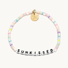 A sunkissed beach days bracelet from Little Words Project. Cheap Beaded Bracelets For Beach Party Season, Cheap Beach Charm Bracelet With Round Beads, Cheap Letter Beads Bracelets For Beach Season, Beach Words, Heishi Bracelets, Beachy Bracelets, Acrylic Bracelet, Wrist Stacks, Bracelet Inspo