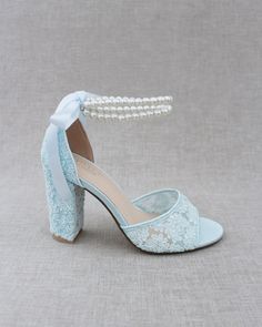 Fun and flirty block heel sandals in crochet lace with double pearl ankle straps. Elegance and classic inspired wear for your special day.DETAILS:HEELS: 3.75 inchesCOLORS AVAILABLE: Ivory, White and Light BlueUPPER: Synthetic upper and liningMATERIALS: Manmade outsoleORIGIN: ImportedSTYLE NAME: FAITH Dusty Blue Heels, Blue Heels With Pearls, Blue Pearl Wedding Shoes, Light Blue 4-inch Block Heels, Fitted Light Blue Heels With 4-inch Heel, Blue High Heel Wedding Shoes With 4-inch Heel, Shoes Editorial, Flower Girl Shoes, Bridal Flats