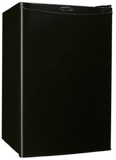 a black refrigerator freezer sitting on top of a white wall