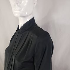 "by Kristin, black blouse with hidden buttons panel and front pleats. Fits Medium 19\" across 23\" long 23\" sleeves * Please review all shop policies before completing transaction. All sales final. No returns or exchanges. * Bundle up for combined shipping. * Instagram @vintagerunsdeepshop" Chic Office Blouse With Pleats, Chic Pleated Blouse For Office, Long Sleeve Pleated Shirt For Work, Pleated Long Sleeve Shirt For Work, Classic Pleated Office Tops, Elegant Pleated Office Blouse, Elegant Pleated Formal Tops, Workwear Shirt With Pleated Long Sleeves, Long Sleeve Pleated Workwear Blouse