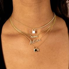 Say your name loud and proud in Adina Eden's Pavé Nameplate Choker, featuring a CZ-stone adorned, upper-case block letter nameplate that sits on an intricate chain of sterling silver, gold or rose gold plated sterling silver. Choose the lettering that means the most to you to create a one-of-a-kind vibe that shines bright, particularly when paired with a few darling pendant necklaces. Product Details Made from Sterling Silver Gold Plated Clear CZ Stones Upper-Case Block Letters Max 10 Letters Na Lock Necklace, Nameplate Necklace, Simple Necklace, Cz Stone, Name Plate, Gold Plated Sterling Silver, Name Necklace, Rose Gold Plates, Sterling Silver Necklaces