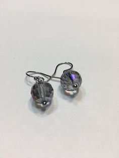 "Blue Aurora Borealis 10mm faceted disco ball glass beads, stainless steel hook wire dangling earrings. 1\" top to bottom, dangle 1/2 inches. Hand made Jewelry! Thanks for stopping by!" Hypoallergenic Round Crystal Earrings For Party, Nickel-free Crystal Earrings For Party, Nickel-free Round Crystal Earrings For Party, Adjustable Crystal Earrings With Faceted Beads, Faceted Crystal Earrings For Party, Nickel Free Czech Glass Beaded Earrings For Party, Nickel-free Czech Glass Beaded Earrings For Parties, Czech Glass Crystal Earrings With Ear Wire, Hypoallergenic Crystal Earrings For Party