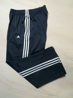 For your consideration is a great looking pair of Adidas men's athletic - lounging pants in a size Large. The pants are preowned in excellent condition with no defects. The pictures are of the actual item you will receive. The material is 100% polyester and is machine washable. The color is black with three white stripes. The pants feature an elastic waist with a drawstring and 2 side pockets. The pants are 42" in total length and the inseam is 29" with a 11" leg opening. I accept Gym Stuff, Adidas Black, Athletic Pants, Black Mesh, Black Adidas, Adidas Men, Adidas Jacket, White Stripe, Elastic Waist