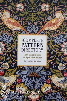 the complete pattern directory book cover with two birds on black and blue floral design, surrounded by flowers