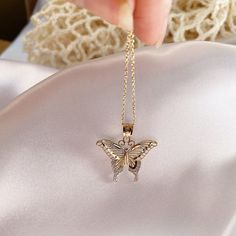 Give her the gift of wings with this beautiful butterfly necklace. DETAILS - 14k yellow gold butterfly with rhodium plating - Chain option is a 14k yellow gold cable chain - Chain style may vary slightly - Approximately 13/16 inch wide x 7/8 inch tall (including bail) VARIATIONS If you require any variation of this style (a different style chain, longer chain, etc.) feel free to message us. We will do our best to accommodate you. Additional costs may apply depending on the variation. POLICY We d Gold Jewelry With Butterfly Charm For Her, Butterfly Charm Jewelry As Gift For Her, Delicate Gold Butterfly Necklace As Gift For Her, Butterfly Necklace As Gift For Her, Dainty Gold Butterfly Jewelry, Dainty Butterfly Charm Necklace In White Gold, Gold Fine Jewelry With Butterfly Charm, White Gold Butterfly Necklace, Dainty Butterfly Yellow Gold Jewelry