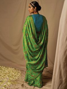 Gratifying green soft silk woven design saree online for women which is crafted from soft silk fabric and comes with soft silk blouse.Checkout this stunning saree online at the best shopping price with express shipping worldwide. Green Cutdana Pre-draped Saree, Festive Green Paithani Silk Pre-draped Saree, Green Cotton Silk Pre-draped Saree For Festivals, Festive Green Silk Pre-draped Saree, Green Silk Pre-draped Saree In Traditional Style, Green Silk Traditional Drape Pre-draped Saree, Green Silk Pre-draped Saree Traditional Drape, Festive Green Pre-draped Saree With Zari Weaving, Green Cotton Silk Blouse Piece With Dupatta