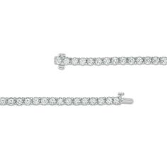 Take your look from ready to resplendent with this marvelous diamond tennis bracelet. Crafted in cool 10K white gold, this timeless choice showcases a row of shimmering 1/8 ct. diamonds. Breathtaking with 6 cts. t.w. of diamonds and a bright polished shine, this 7.0-inch bracelet secures with a tongue and groove clasp. Classic White Diamond Bracelet With Accents, Classic White Diamond Cut Bracelet, Classic White Diamond-cut Bracelet, Classic White Round Cut Diamond Bracelet, Classic Lab-grown Diamond Tennis Bracelet, Classic Diamond Tennis Bracelet With Accents, Anniversary White Gold Tennis Bracelet With Diamond Accents, Anniversary Diamond Bracelet With Diamond Accents, Classic Formal Tennis Bracelet With Lab Grown Diamonds