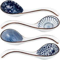 three ceramic spoons with designs on them, one is blue and the other is white