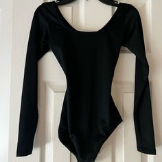 So Danca Black Long Sleeve Leotard. Never Worn Solid Color Dancewear Bodysuit For Party, Dancewear Bodysuit For Parties, Stretch One-piece Elastane Leotard, Stretch Party Leotard, Party Leotard Solid Color With Stretch, Solid Stretch Party Leotard, Stretch Dancewear Bodysuit With Lined Body, Solid Stretch Leotard For Dancewear, Stretch Dancewear Leotard