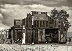 black and white photograph of an old fashioned garage