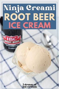 two scoops of ice cream sitting on top of a table next to a bottle