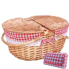 two wicker baskets with red and white checkered cloths on the bottom one is empty