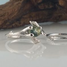 Made-to-Order Custom Twig Bridal Set using a Beautiful Natural Green Montana Sapphire Gemstone Ring. Hand sculpted Twig Bridal Set, hand sculpted, a one-of-a-kind creation. I wanted to create a beautiful yet elegant bridal set using a polished faceted Gemstone using my organic twig design. ● 5.2mm aproximately 1/2 carat round polished faceted natural Montana Sapphire (SHOWN) OPTIONS: So many round 1/2 carat gemstones are available to use in my twig setting. To name a few, Opal, Sapphires, Rubies Nature-inspired White Gold Wedding Rings, Nature-inspired Solitaire Jewelry For Weddings, Nature-inspired Wedding Rings With Prong Setting, Nature-inspired Diamond Wedding Jewelry, Nature-inspired Wedding Jewelry With Prong Setting, Silver Nature-inspired Wedding Jewelry, Nature-inspired Wedding Jewelry With Accent Stones, Nature-inspired Silver Wedding Jewelry, Unique Solitaire Jewelry For Wedding