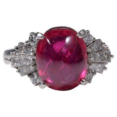 an oval shaped ruby and diamond ring