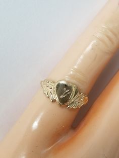 "Thanks for shopping our vintage estate store. We tend to sell well below wholesale and truly hope you enjoy all of our items. Many of the items are one of a kind, so please enjoy scrolling through the pictures and hopefully something will catch your eye. Brown spots are from camera or reflections. Estate 14k yellow gold monogram cursive capital V heart ring. Custom made ring for our shop. Ring size: 3 Setting: 7.5mm 1/4\" to 3/8\" Band width: 1.4mm Weight: .90 gram Marked 14k and it's sweet. On Vintage White Gold Rings With Initials, Classic Heart Shaped 14k Engraved Ring, Vintage White Gold Initial Ring In 14k, Vintage 14k White Gold Initial Ring, Classic Engraved Heart Ring Stamped 14k, Vintage Signet Ring For Anniversary, Vintage White Gold Initial Ring Stamped 14k, Heirloom Engraved Heart Ring For Anniversary, Heirloom Jewelry With Hallmarks For Valentine's Day