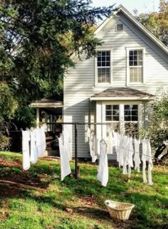 clothes hanging out to dry in front of a house