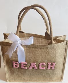 Thank you for visiting Designs By Kenia! Every time you shop small, you are supporting someone's dream and I am SO thankful that you have chosen to support mine! Beach Tote Bag|Girls Trip Tote Bag|Persoanlized Beach Bag|Summer Beach Bag|Gifts For Her|Beach Trip|Beach Tote This bag Is the perfect beach bag bag to carry all the beach essentials. Our bags are personalized with letter paches. The letters are beautiful and you get to choose what color letters you want. All letters will have the gold Beige Bags For Beach Season Gift, Cute Beige Shoulder Bag For Vacation, Pink Summer Vacation Bag, Cute Rectangular Shoulder Bag For Vacation, Pink Shoulder Bag For Beach Vacation, Pink Beachy Bag For Vacation, Summer Vacation Pink Bag, Pink Beachy Bags For Vacation, Pink Rectangular Beach Bag For Beach Season