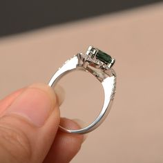 This is a gorgeous handmade creation. Its beauty is its simplicity & Elegance. The 7*7mm cushion cut lab green sapphire is crafted in solid sterling silver and with rhodium plated. All item is sent in a beautiful gift box You can realize more lovely stuff clicking the link https://www.etsy.com/shop/knightjewelry?refshopsection_shophome_leftnav Please leave the correct address and you phone number for delivering successfully. Green Sapphire Ring With Halo Setting For Promise, Silver Emerald Ring With Asscher Cut Cubic Zirconia, Silver Radiant Cut Emerald Ring For May Birthstone, Silver Emerald Ring With Halo Detail, Radiant Cut Silver Emerald Ring For May Birthstone, Silver Radiant Cut Emerald Ring With Halo Setting, Green Sapphire Rings With Halo Setting, Green Cushion Cut Emerald Ring With Accent Stones, Silver Emerald Ring With Cushion Cut