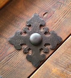 a metal object on top of a wooden table