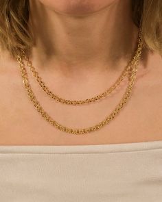 This accessory is double the glamour! Luxe layers make this necklace a perfect addition to any outfit. You'll turn heads when you wear this piece in both gold and silver tones. Available in gold and silver tones. Materials: 14K gold or rhodium plated brass Features: Measures 16-18" with 2" extender, 0.15" chain width, Lead & Nickel free, lobster clasp Elegant Double Strand Metal Chain Necklace, Formal Double Strand Metal Chain Necklace, Yellow Gold Chain Necklace For Parties, Elegant Gold Choker Long Necklace, Elegant Gold Long Necklace Choker, Yellow Gold Long Chain Necklace, Yellow Gold Necklace For Party, Elegant Gold Long Choker Necklace, Chic Double Strand Adjustable Chain Necklace