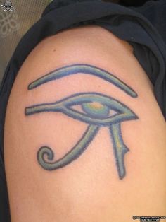 an egyptian eye tattoo on the arm