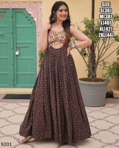 Latest Designer Cotton Printed Kutchi Gamthi Kodi Work Long Anarkali Navratri Gown Collection 2024, Ready To Wear Indian Garba Gown Dress Fabric - Cotton Lining (Inner) - Cotton (Full Up to Bottom) . Type - Readymade Size - S(36), M(38), L(40), XL(42), XXL(44) Work - Printed, Kutchi Gamthi Work And Kodi Lace Length - 56 Inch Flair - 4 Meter Weight - 1 Kg Occasion - Navratri Festival 𝐒𝐞𝐫𝐯𝐢𝐜𝐞𝐬 * Stitching Service Is Available On Customer Demand. Please Get In Touch With Us For Stitching Service. * Beware Of Fake Sellers. We Are Giving Assured Quality. Our Strong Quality Check System Has A 0% Defect Rate. So You Will Always Receive An Excellent Product. * We Also Take Bulk Orders For Weddings And Other Occasions * We Customize Everything When It Comes To Ethnic Wear. * We Also Make Pl Latest Navratri Collection 2024, Designer Traditional Maxi Length Wear For Navratri, Designer Traditional Wear For Navratri In Maxi Length, Traditional Maxi Length Wear For Navratri, Bohemian Anarkali Set With Cutdana, Maxi Length, Bohemian Maxi-length Dupatta, Designer Wear Ankle-length Sharara For Navratri, Designer Ankle-length Sharara For Navratri, Traditional Sleeveless Anarkali Set With Dabka Work