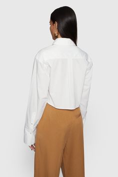 The Layne shirt is crafted from soft cotton in a cropped length that pairs perfectly with your favorite high-rise denim. Finished with a bust pocket, point collar and front button closures. | Rebecca Minkoff Layne Cropped Shirt In White - Size M Tuxedo Studs, Leather Outerwear, Cropped Shirt, Shoe Size Conversion, Leather Dresses, High Rise Denim, Crop Shirt, Large Bust, Rebecca Minkoff