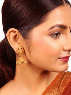 Crafted from 925 silver with a lustrous gold polish, this Jhumka showcases a traditional design. The stud section is elegantly adorned with a Lakshmi motif, while the round floral-designed Jhumka with dangling elements exudes opulence, adding substantial value to this exquisite piece. Please refer to the pictures of the jewelry worn on a model to get a clear idea of the size. Condition: New. This product is intricately designed and meticulously handcrafted with exceptional care by our skilled si 22k Gold Earrings For Puja, Gold Earrings For Puja, Elegant Intricate Design Earrings For Puja, Traditional 22k Gold Bridal Earrings For Festive Occasions, 22k Gold Jhumkas With Latkans For Navratri, Elegant Meenakari Earrings For Puja, 22k Gold Jewelry For Puja, Meenakari 22k Gold Earrings, Gold Chandbali Bridal Earrings For Puja