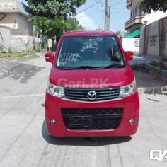 a red van parked on the side of a road